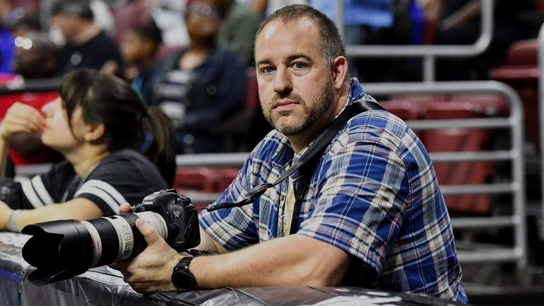 Mike Kruce holding a camera
